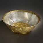 A superb and important parcel-gilt silver 'lotus and pomegranate' bowl, Tang dynasty | 唐 銀局部鎏金石榴蓮花紋花式大盌