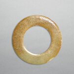 A white jade disc, huan, Western Han dynasty | 西漢 勾雲紋白玉環