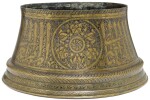 A MAMLUK SILVER-INLAID BRASS CANDLESTICK BASE, EGYPT OR SYRIA, 14TH CENTURY