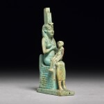 AN EGYPTIAN TURQUOISE FAIENCE FIGURE OF ISIS WITH HORUS, PTOLEMAIC PERIOD, 304-30 B.C.