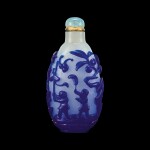 A blue overlay snowflake-white glass 'twin boys and birds' snuff bottle Qing dynasty, 18th - 19th century | 清十八至十九世紀 雪霏地套藍料吉慶童子及喜上眉梢圖鼻煙壺