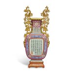 An imperially inscribed ruby-ground sgraffiato 'yangcai' wall vase, Qing dynasty, Qianlong period | 清乾隆 洋彩胭脂紅地軋道開光御題詩壁瓶