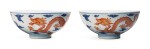 A pair of blue and white and iron-red 'dragon' bowls, Qing dynasty, 19th century
