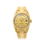 ROLEX | REFERENCE 18238 DAY-DATE A YELLOW GOLD, DIAMOND AND RUBY-SET AUTOMATIC WRISTWATCH WITH DATE, DAY AND BRACELET, CIRCA 1990