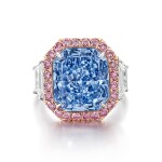 A Magnificent and Important Fancy Vivid Blue Diamond and Diamond Ring