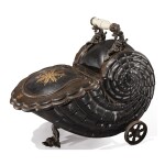 A BLACK AND GOLD PAINTED TOLE SHELL-FORM PURDONIUM ON WHEELS