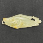 A celadon jade 'fish and lotus' pendant, Qing dynasty 清　青白玉鯰魚荷花珮飾