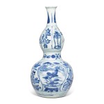 A blue and white 'floral' double-gourd vase, Late Ming dynasty | 明末 青花開光花卉圖葫蘆瓶