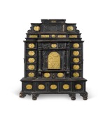 A South German gilt-metal mounted, ebonised and carved table cabinet, possibly Augsburg, early 17th century