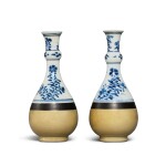A pair of blue and white and cafe-au-lait garlic-necked bottle vases, Qing dynasty, Kangxi period | 清康熙 青花花卉紋淺醬釉瓶一對