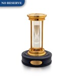 De Beers | A gilt brass hourglass with floating diamonds, Circa 2000 | 鍍金銅製沙漏，備浮動鑽石，約2000年製