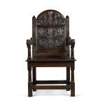 A Charles II carved oak panel back armchair, Lancashire/North Cheshire