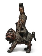 A LARGE LACQUERED AND GILT-WOOD FIGURE OF SIMHANADA AVOLOKITESHVARA,  LATE MING / EARLY QING DYNASTY