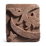 A carved sandstone tile fragment from a frieze with calligraphic letter terminal, India, probably Delhi, circa 1200-25 AD