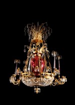 A large neoclassical gilt-bronze cut-crystal and red glass thirty-light chandelier | Grand lustre à trente lumières en cristal, verre rouge et bronze néoclassique