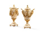 A pair of Louis XVI gilt-bronze mounted turned and engraved ivory covered vases by Francois Voisin and Pierre-Philippe Thomire, circa 1785