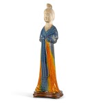 A rare and beautifully modelled blue and amber-glazed pottery figure of a court lady Tang dynasty | 唐 三彩仕女陶俑