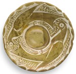 A SMALL ABBASID LUSTRE POTTERY BOWL DEPICTING TWO BIRDS, IRAQ, 10TH CENTURY