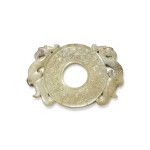 A pale celadon and grey jade disc-shaped pendant, Western Han dynasty 西漢 青白玉雙鳳出廓璧