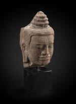 A grey sandstone head of a divinity Khmer, Bayon style, circa 12th century | 高棉 約十一世紀 巴普昂式砂岩雕神首