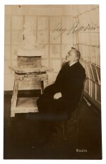 RODIN | postcard photograph signed, showing Rodin seated beside "Psyché et l'Amour", c. 1911