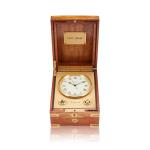 Reference 1215 Naviquartz, A gilt brass table clock with wooden box, Circa 1980