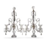 A pair of George III cut-glass twin-branch table candelabra, late 18th/early 19th century, in the manner of Parker and Perry