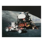 [APOLLO 17]. EXPLORING TAURUS LITTROW. COLOR PHOTOGRAPH, SIGNED AND INSCRIBED BY GENE CERNAN