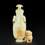 A white and russet jade 'bird and mythical beast' vase and cover, 17th - 18th century |  十七至十八世紀 白玉雕朱雀瑞獸蓋瓶