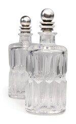 A PAIR OF GLASS DECANTERS WITH DANISH SILVER STOPPERS, NO. 206C, DESIGNED BY HARALD NIELSEN, GEORG JENSEN SILVERSMITHY, COPENHAGEN, CIRCA 1915-27