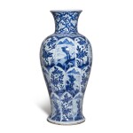 A blue and white 'floral' vase, Qing dynasty, Kangxi period | 清康熙 青花開光山水花卉圖瓶