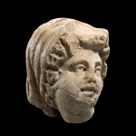 A ROMAN MARBLE RELIEF HEAD OF A WOMAN, 3RD CENTURY A.D.