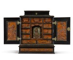 A Bohemian carved walnut and ebonised cabinet attributed to Adam Eck, Eger, mid-17th century