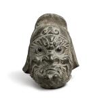 A carved stone head of a guardian, Tang dynasty | 唐 石雕天王首像