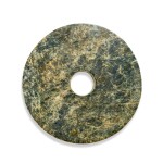 A large calcified green jade bi disc, Neolithic period 新石器時代 青玉璧