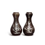 A pair of 'Zhangzhou' brown-glazed slip-decorated 'prunus' garlic-mouth vases, Late Ming dynasty | 明末 漳州窰醬地白花梅花紋蒜頭瓶一對