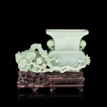 A very rare imperial inscribed pale celadon jade 'prunus' vase with original zitan stand, Qing dynasty, Qianlong period |  清乾隆 御製青白玉詠梅御題詩太平有象瓶 《乾隆御題》款 原配紫檀鏤雕松竹紋座