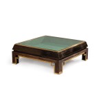 A black wood and gilt-metal coffee table, modern, attributed to maison Jansen | Table basse en bois peint et métal doré, moderne, attribuée à maison Jansen