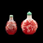 Two red overlay glass snuff bottles, Qing dynasty, late 18th - early 19th century | 清十八世紀末至十九世紀初 透明地套紅料蓮塘圖鼻煙壺 及 珍珠地套紅料八仙賀壽圖鼻煙壺一組兩件