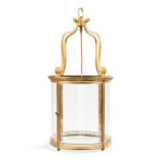 A Louis XVI style gilt-bronze and glass lantern | Lanterne en bronze doré et verre de style Louis XVI