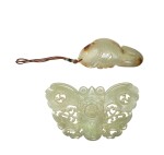 A celadon jade 'butterfly' belt buckle and a 'carp' pendant, Qing dynasty