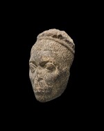 A Fragmentary Egyptian Basalt Head of a Man, Roman Period, circa 1st/2nd Century A.D.