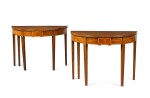 A pair of George III boxwood strung and crossbanded mahogany demi-lune card tables by Gillows, 1788