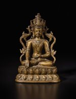 A copper alloy figure of Akshobya Buddha, Tibet, 14th century | 西藏 十四世紀 銅合金嵌寶阿閦佛坐像
