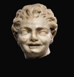 A ROMAN MARBLE HEAD OF A BOY, CIRCA 2ND CENTURY A.D