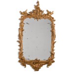 A George II carved giltwood mirror, circa 1750, in the manner of Matthias Lock