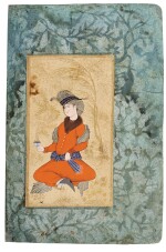 A SEATED YOUTH HOLDING A CUP OF COFFEE, PERSIA, SAFAVID, MID-17TH CENTURY