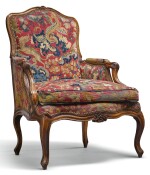 A LOUIS XV CARVED WALNUT FAUTEUIL CIRCA 1750