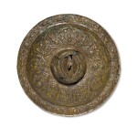 A Khurasan repoussé bronze zodiac boss, Persia, 12th century