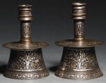 TWO MINIATURE MAMLUK SILVER AND GOLD-INLAID BRASS CANDLESTICKS, EGYPT OR SYRIA, EARLY 15TH CENTURY